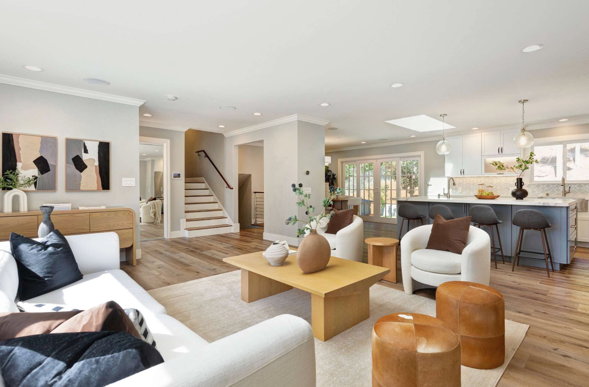 298 Elysian Fields Drive — Sun-drenched living room with picture windows and hardwood floors