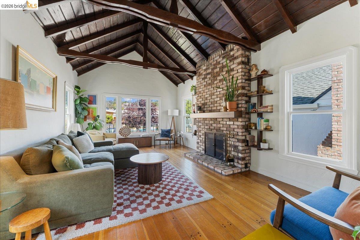 5327 Brann Street, Maxwell Park, Oakland — living room with a vaulted beamed ceiling, brick fireplace and hardwood floors