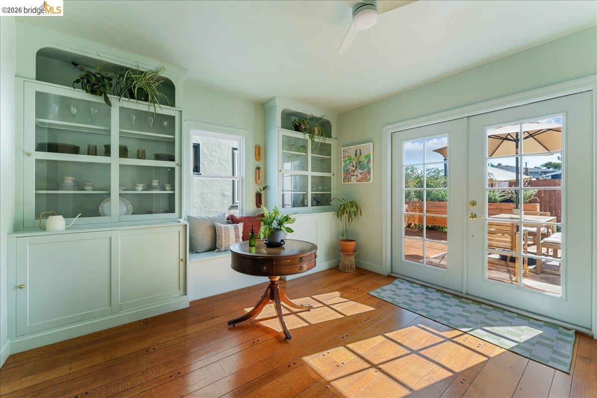 5327 Brann Street — built-in china cabinets and French doors opening onto a deck set for outdoor dining