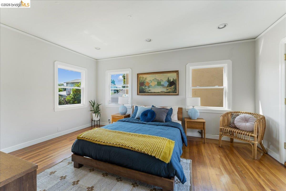 5327 Brann Street — bedroom with hardwood floors and windows on two walls